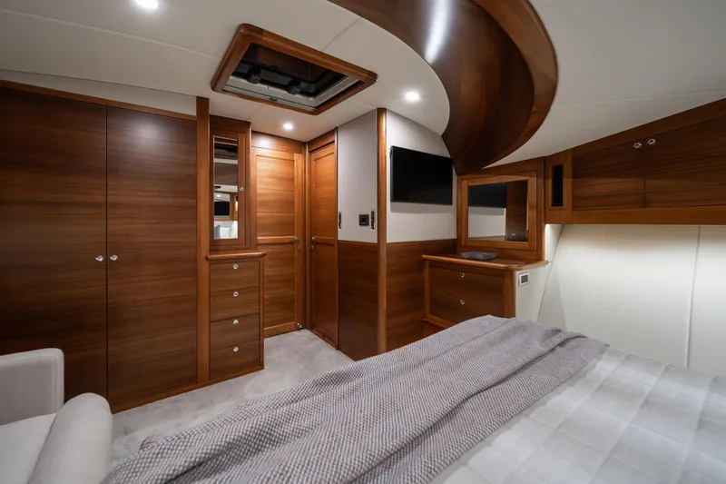Slide: The Image of Luxurious interior of 2026 Palm Beach Motor Yachts PB70 with elegant wood finishes. - 10