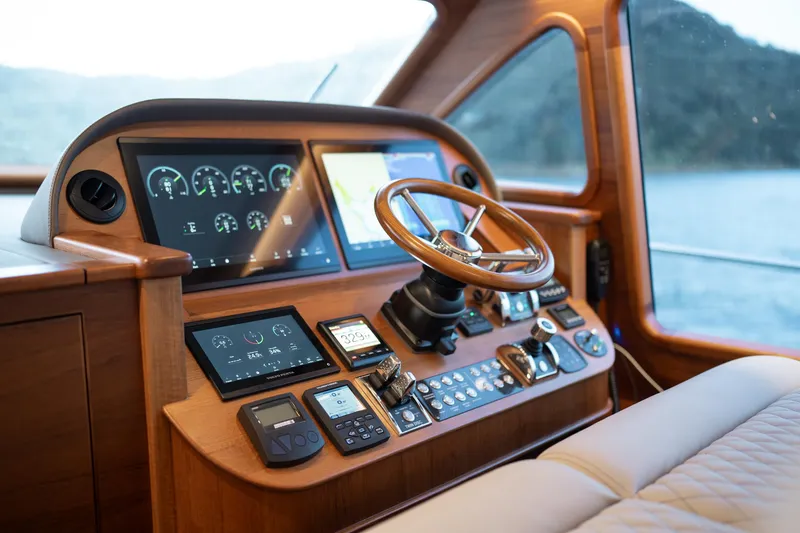 Slide: The Image of Helm of 2026 Palm Beach Motor Yachts PB70, featuring advanced navigation controls and luxurious design. - 15
