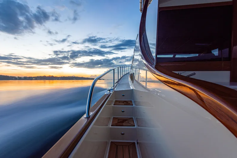 Slide: The Image of 2026 Palm Beach Motor Yachts PB70 cruising at sunset, sleek design and luxurious finish. - 22