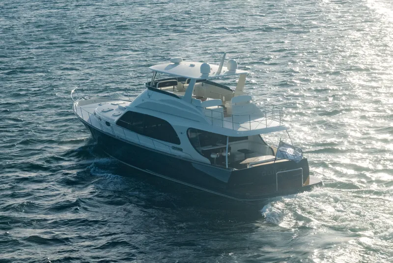 Slide: The Image of 2026 Palm Beach Motor Yachts PB70 cruising on open water, showcasing luxury design. - 7