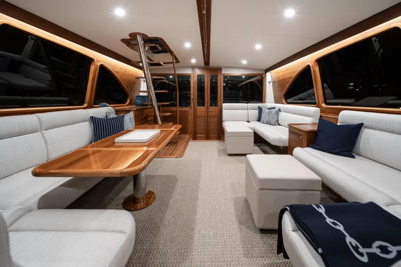 Slide: The Image of Luxurious interior of 2026 Palm Beach Motor Yachts PB70 with elegant seating and wooden accents. - 9
