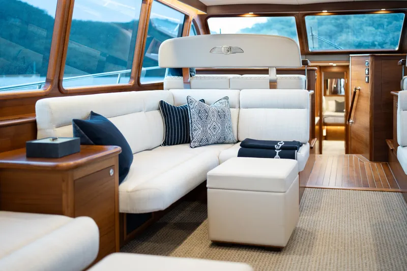 Slide: The Image of Luxurious interior of 2026 Palm Beach Motor Yachts PB70, featuring elegant seating and wooden accents. - 16