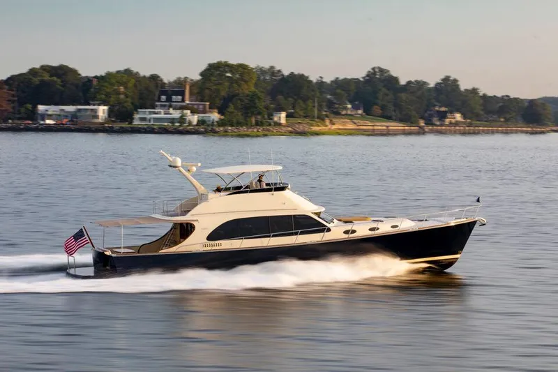 Slide: The Image of 2026 Palm Beach Motor Yachts PB70 cruising on a serene waterway, showcasing sleek design and luxury. - 5