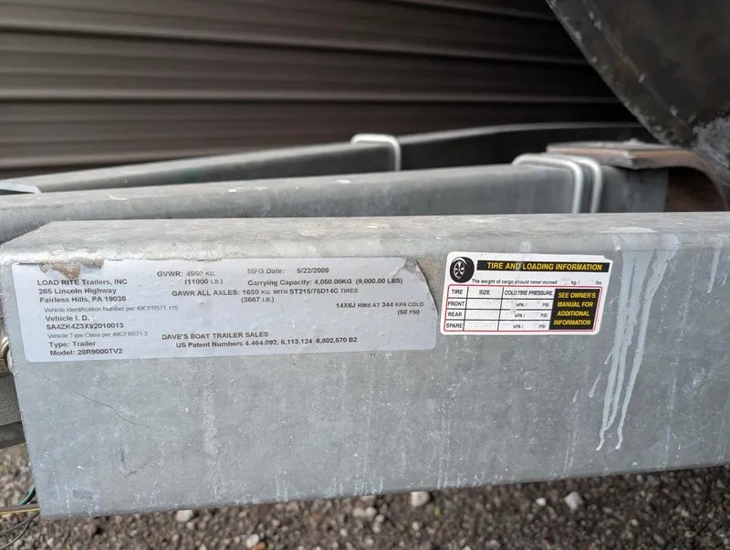 Slide: The Image of Trailer label for 1989 Marinette 28 Sport Fish Fly Bridge, showing tire and loading information. - 19