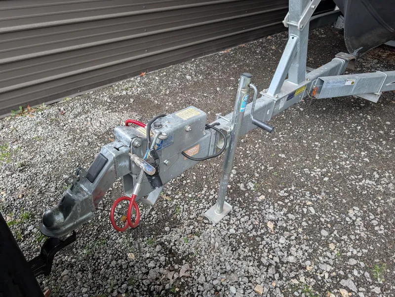 Slide: The Image of Trailer hitch for 1989 Marinette 28 Sport Fish Fly Bridge on gravel surface. - 21