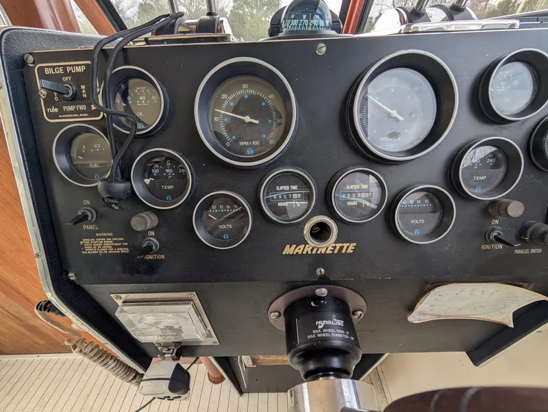 Slide: The Image of Control panel of 1989 Marinette 28 Sport Fish Fly Bridge boat with gauges and switches. - 5
