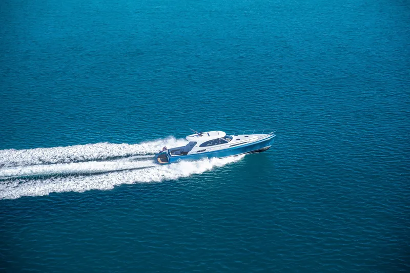 Slide: The Image of 2026 Palm Beach Motor Yachts GT50 cruising on open blue water. - 11