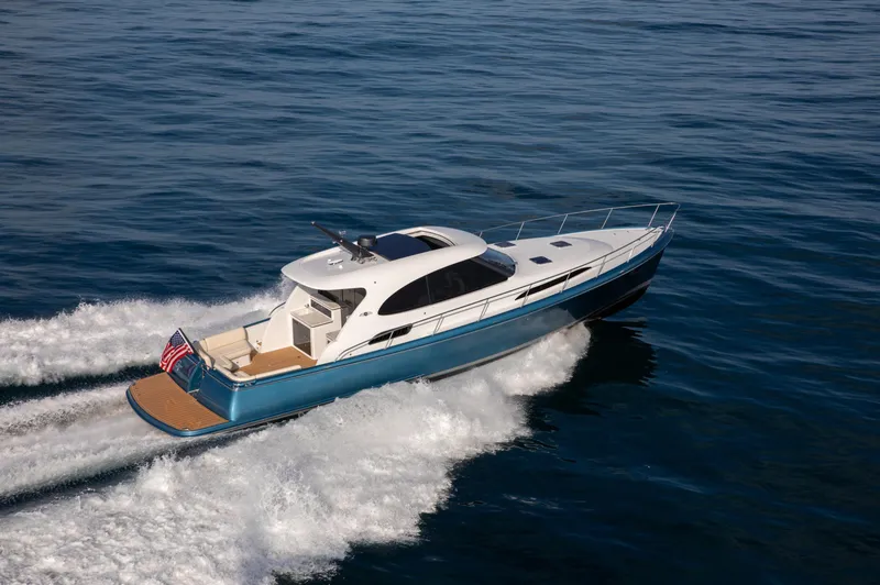 Slide: The Image of 2026 Palm Beach Motor Yachts GT50 cruising on open water, showcasing sleek design and performance. - 2