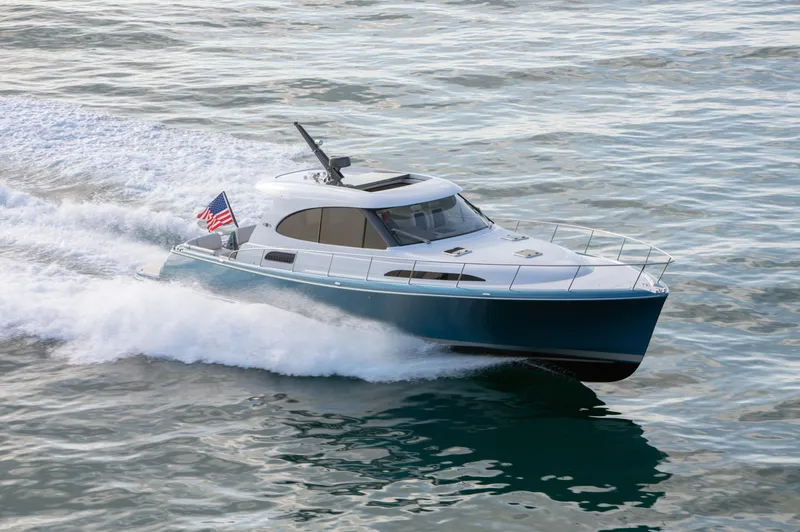 Slide: The Image of 2026 Palm Beach Motor Yachts GT50 cruising on open water, displaying sleek design and performance. - 3