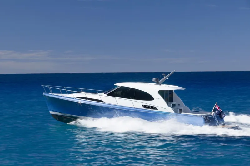 The Image of 2026 Palm Beach Motor Yachts GT50 cruising on open blue sea. - 0