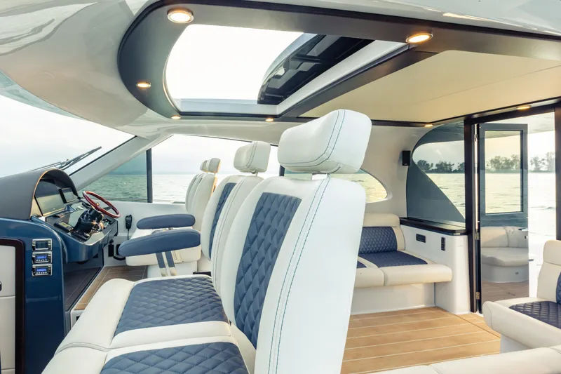 Slide: The Image of Luxurious interior of 2026 Palm Beach Motor Yachts GT50 with elegant seating and panoramic views. - 12