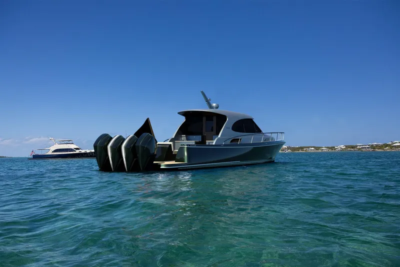 Slide: The Image of 2026 Palm Beach Motor Yachts GT50 on clear blue water, showcasing sleek design and powerful engines. - 4