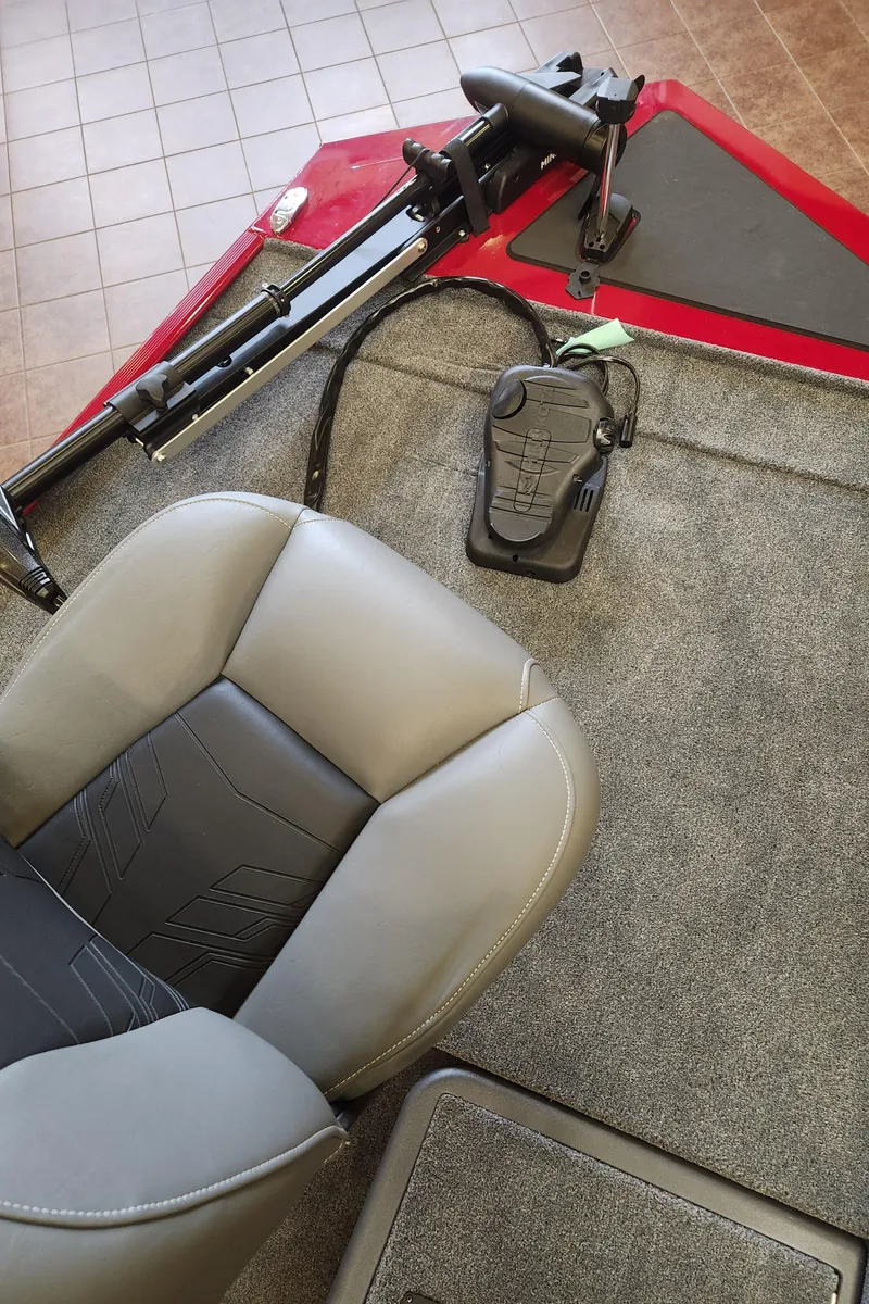 Slide: The Image of 2025 Tracker Bass Tracker Classic XL boat interior with gray seating and carpeted flooring. - 4