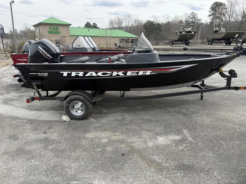 The Image of 2025 Tracker Pro Guide V-16 SC boat on trailer in outdoor setting. - 0