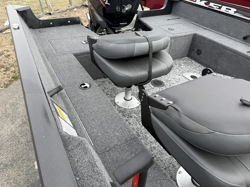 Slide: The Image of 2025 Tracker Pro Guide V-16 SC boat interior with gray seating and carpeted flooring. - 11
