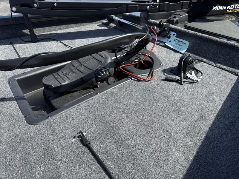 Slide: The Image of 2025 Tracker Pro Team 190 boat deck with Minn Kota trolling motor controls. - 11