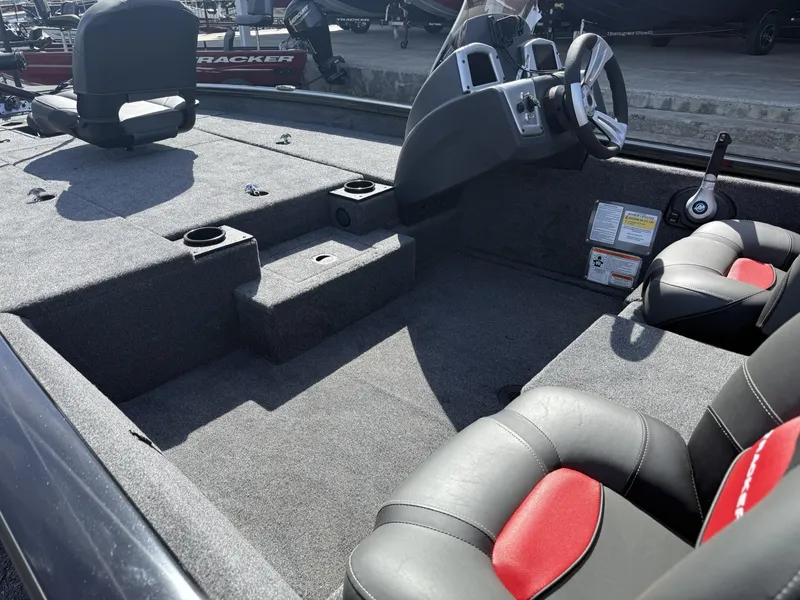 Slide: The Image of 2025 Tracker Pro Team 190 boat interior with seating and steering console. - 5