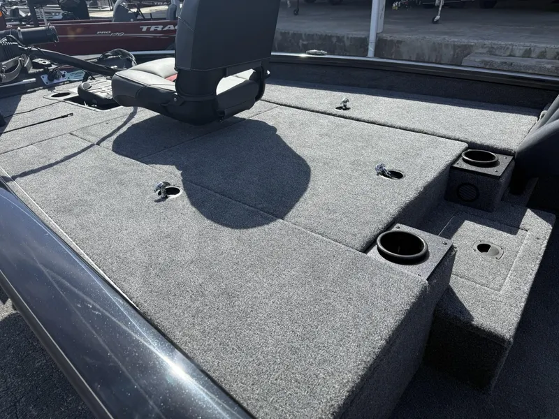 Slide: The Image of 2025 Tracker Pro Team 190 boat deck with seating and storage compartments. - 7