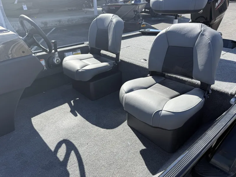 Slide: The Image of 2025 Tracker Bass Tracker Classic XL interior with two gray seats. - 6