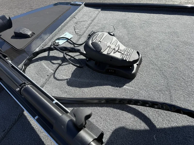 Slide: The Image of 2025 Tracker Bass Tracker Classic XL boat deck with trolling motor pedal. - 8