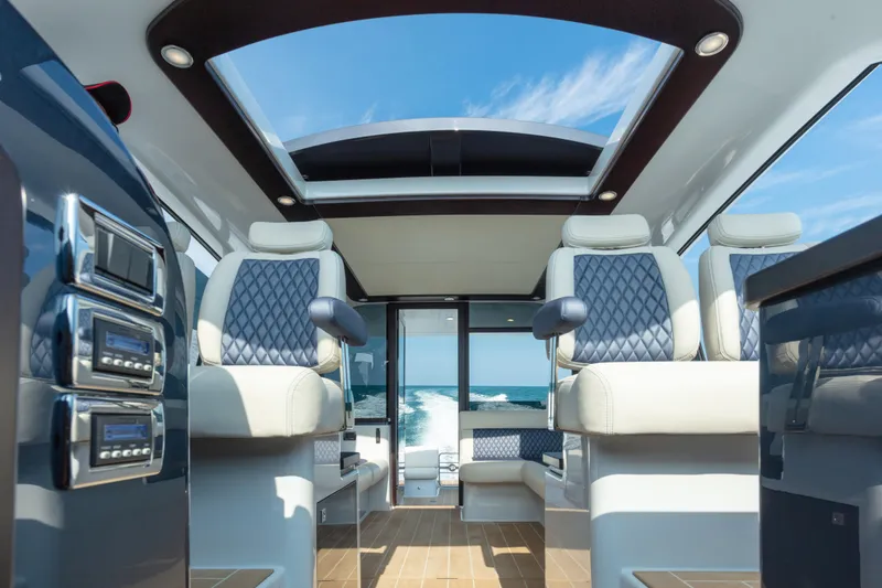 Slide: The Image of Interior of 2026 Palm Beach Motor Yachts GT50, featuring luxurious seating and panoramic views. - 14