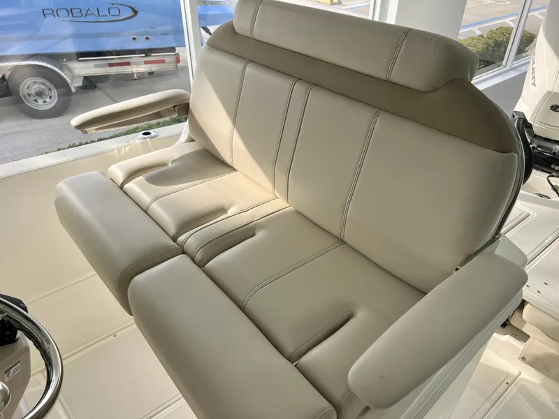 Slide: The Image of 2025 Boston Whaler 250 Dauntless boat seat, beige upholstery, comfortable design. - 11