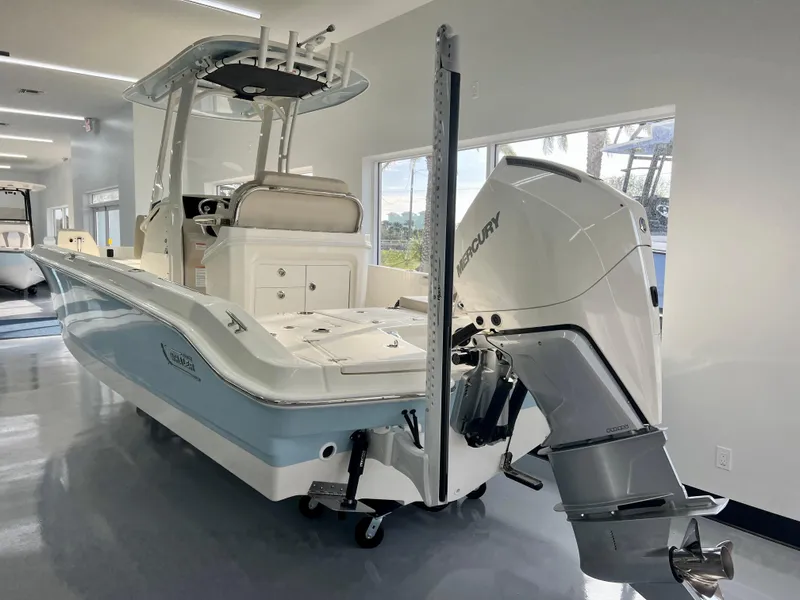 Slide: The Image of 2025 Boston Whaler 250 Dauntless boat with Mercury engine in showroom. - 4