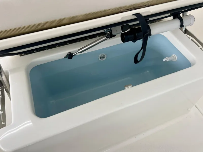 Slide: The Image of Livewell in 2025 Boston Whaler 170 Montauk boat, showcasing interior features. - 11