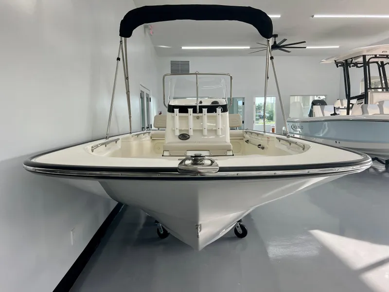 Slide: The Image of 2025 Boston Whaler 170 Montauk boat displayed indoors, showcasing sleek design and modern features. - 3