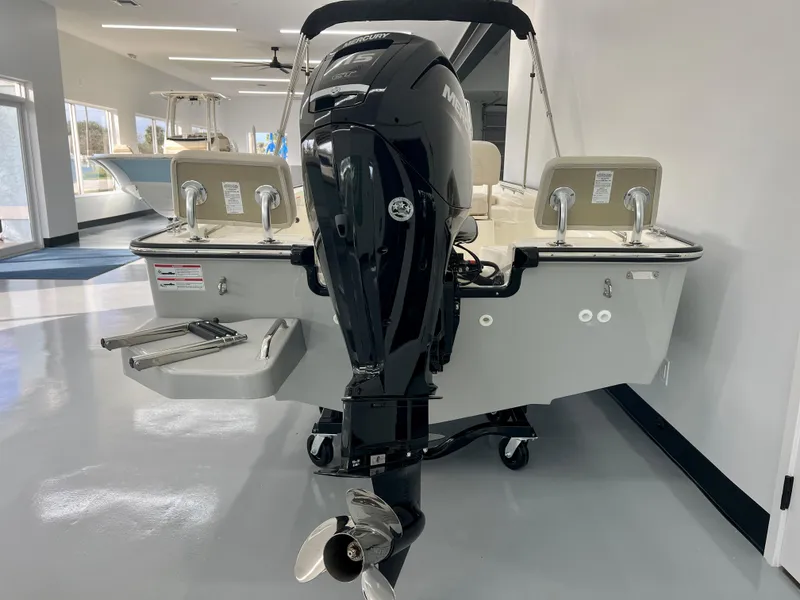 Slide: The Image of 2025 Boston Whaler 170 Montauk boat with outboard motor in showroom. - 5