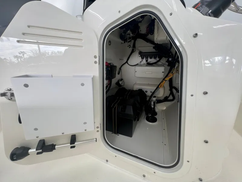 Slide: The Image of 2025 Boston Whaler 170 Montauk storage compartment, showcasing interior details and equipment. - 9