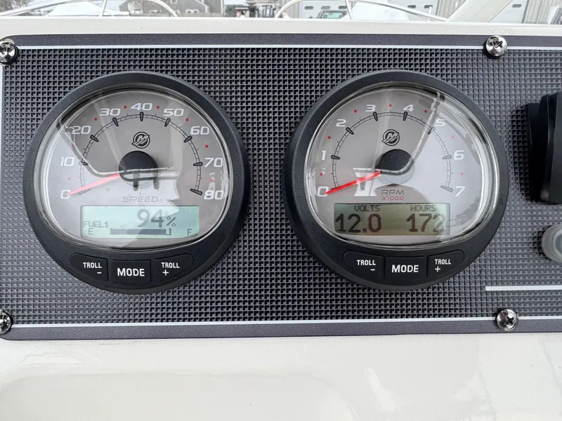 Slide: The Image of Dashboard of 2023 Boston Whaler 190 Montauk showing speed and RPM gauges. - 11