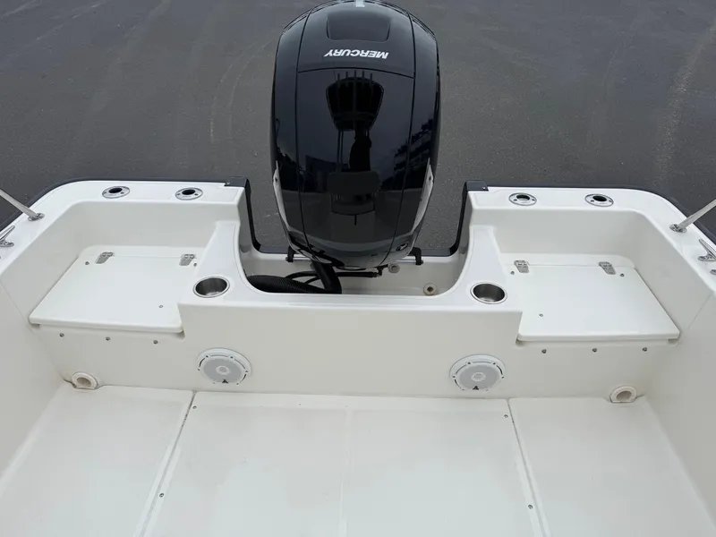 Slide: The Image of 2023 Boston Whaler 190 Montauk boat with Mercury outboard motor, rear deck view. - 16