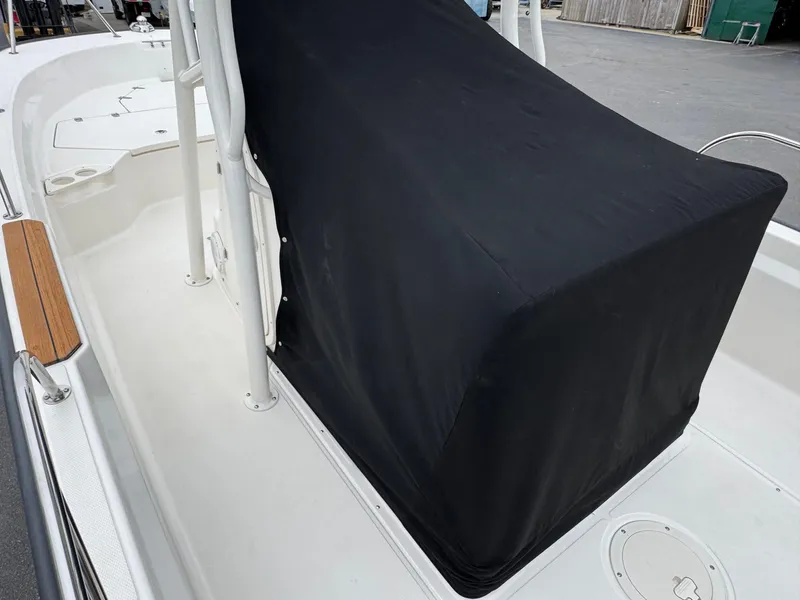 Slide: The Image of 2023 Boston Whaler 190 Montauk boat deck with covered console. - 19