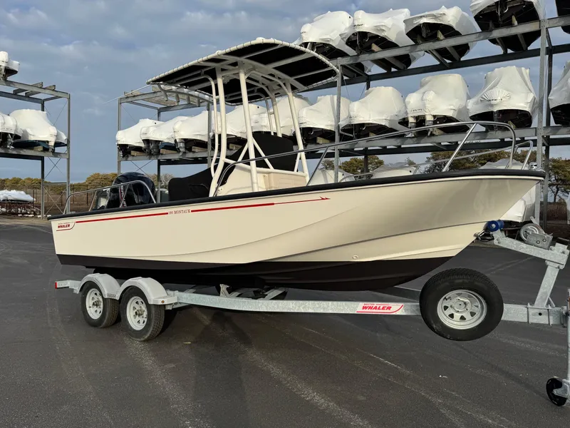 Slide: The Image of 2023 Boston Whaler 190 Montauk boat on trailer, parked in storage facility. - 3