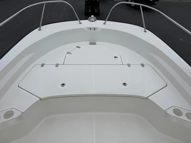 Slide: The Image of 2023 Boston Whaler 190 Montauk boat deck with storage compartments and railing. - 6