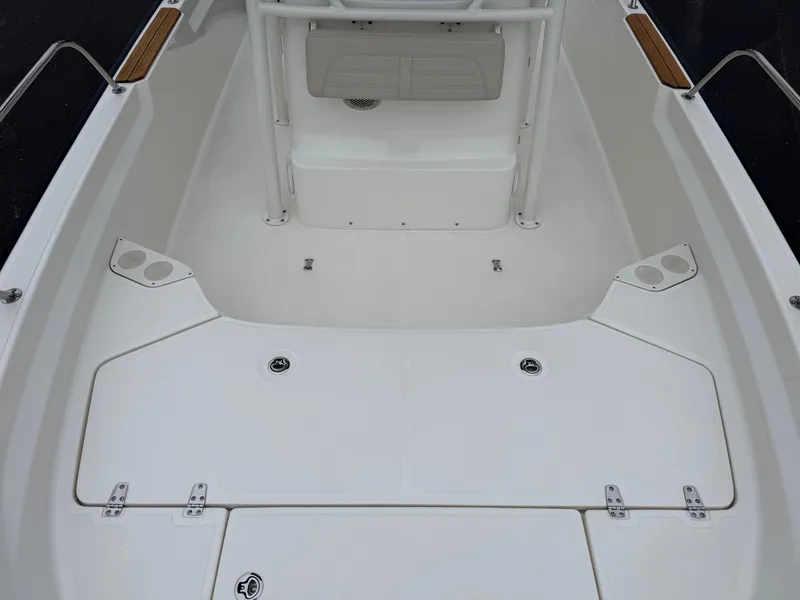 Slide: The Image of 2023 Boston Whaler 190 Montauk boat interior, featuring a spacious white deck layout. - 8