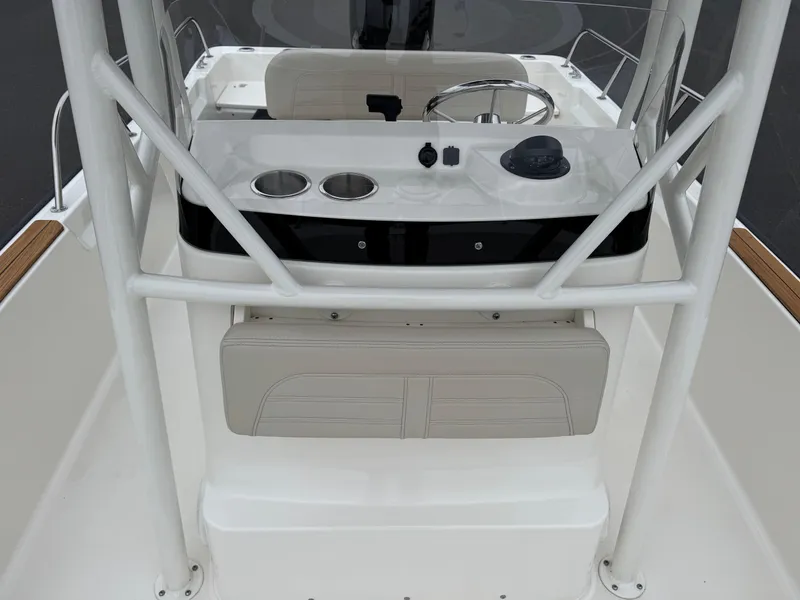 Slide: The Image of 2023 Boston Whaler 190 Montauk boat console with steering wheel and cup holders. - 9