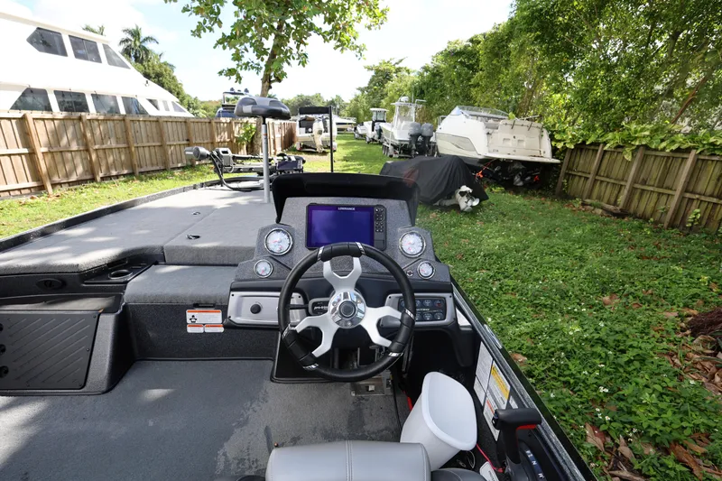 Slide: The Image of Interior view of a 2022 Nitro Z20 Pro boat, featuring steering wheel and dashboard. - 11