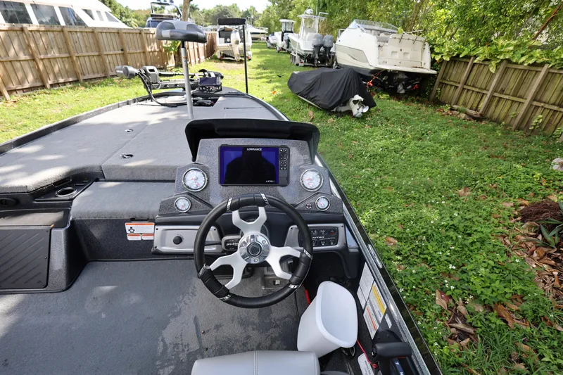 Slide: The Image of Nitro Z20 Pro 2022 boat dashboard with steering wheel and navigation system. - 15