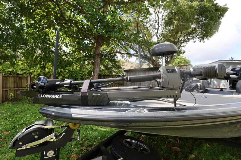 Slide: The Image of 2022 Nitro Z20 Pro boat with Lowrance equipment, parked outdoors. - 17