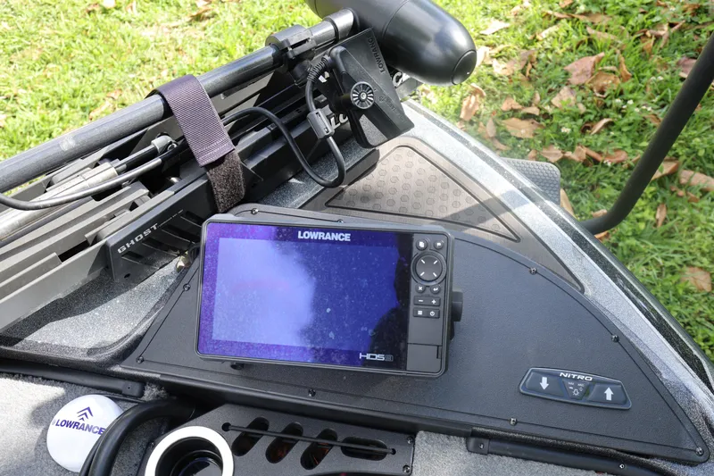 Slide: The Image of Lowrance HDS display on 2022 Nitro Z20 Pro boat dashboard, surrounded by fishing equipment. - 19