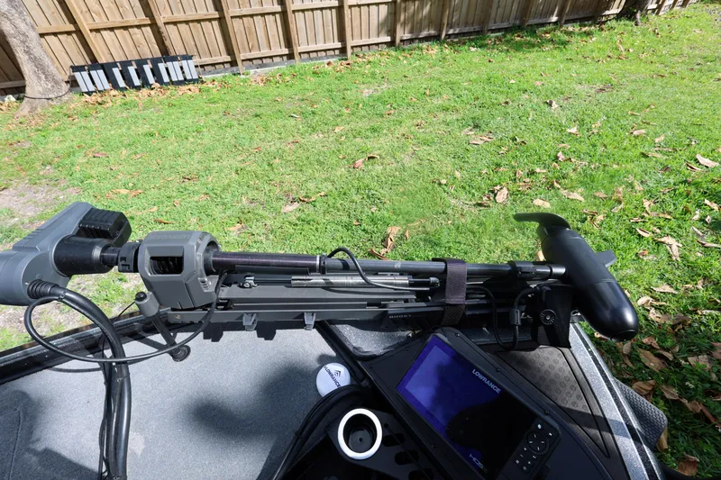 Slide: The Image of Nitro Z20 Pro 2022 boat equipment on grass with wooden fence background. - 20