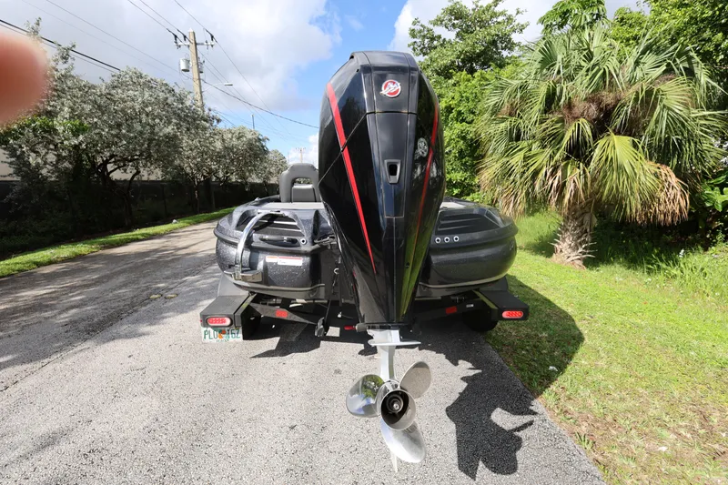 Slide: The Image of 2022 Nitro Z20 Pro boat on trailer, parked on a sunny road. - 7