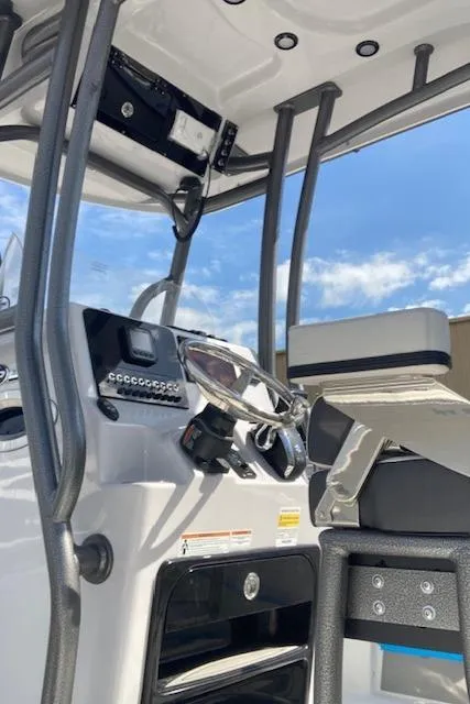 Slide: The Image of 2025 Sea Pro 230 Bay boat console with modern controls and clear sky background. - 3
