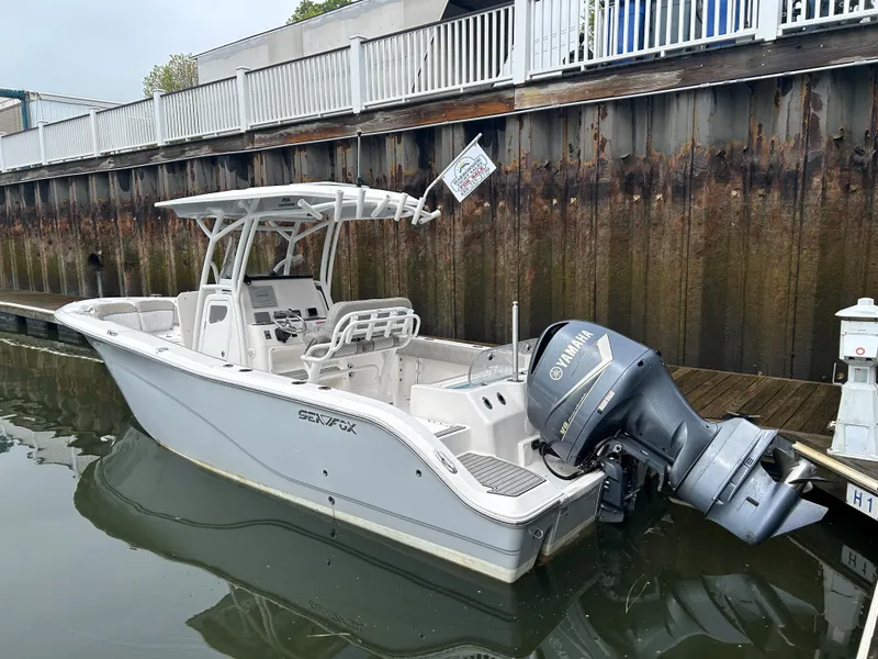Slide: The Image of 2018 Sea Fox 266 Commander boat docked with Yamaha outboard engine. - 5