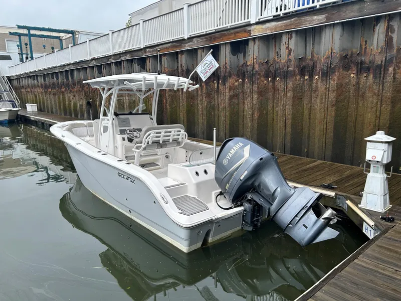 Slide: The Image of 2018 Sea Fox 266 Commander boat docked with Yamaha outboard motor. - 6