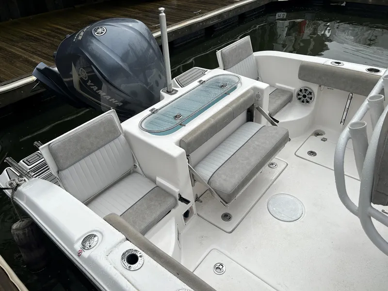 Slide: The Image of 2018 Sea Fox 266 Commander boat interior with seating and Yamaha outboard motor. - 7