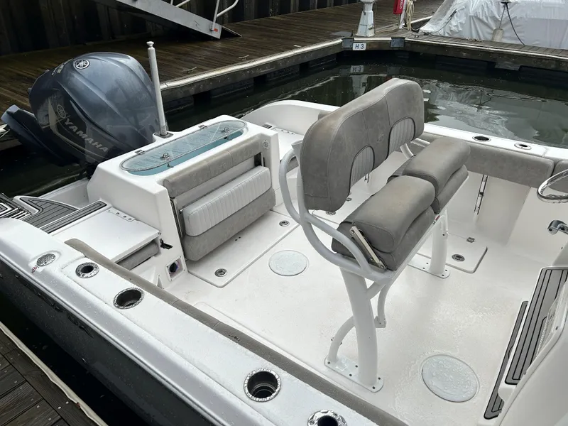 Slide: The Image of 2018 Sea Fox 266 Commander boat interior with seating and Yamaha outboard motor. - 8