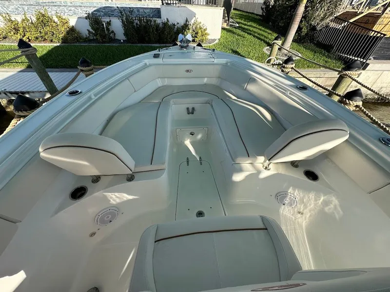 Slide: The Image of 2022 Sea Hunt Ultra 255 SE boat interior with seating and storage compartments. - 8